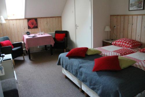 En eller flere senge i et værelse på Hoeve Op Vollenhof