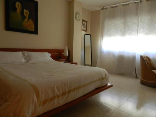 מיטה או מיטות בחדר ב-Vallnord La Massana