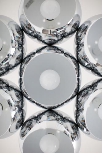 a group of silver plates and bowls on a table at Trend Apartmanház -Vizslás in Vizslás