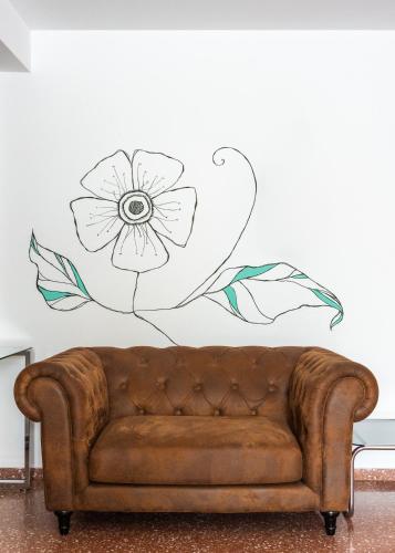 Un lugar para sentarse en Hostal Jume - Urban Rooms