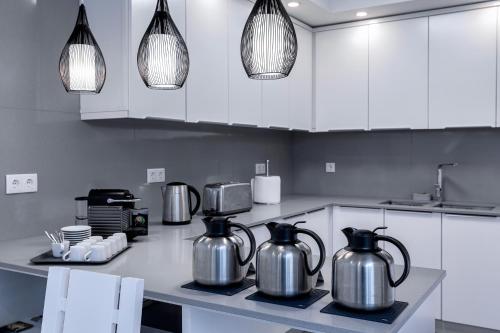 a kitchen with two kettles sitting on a counter at Ilheu 25 Peniche House in Peniche