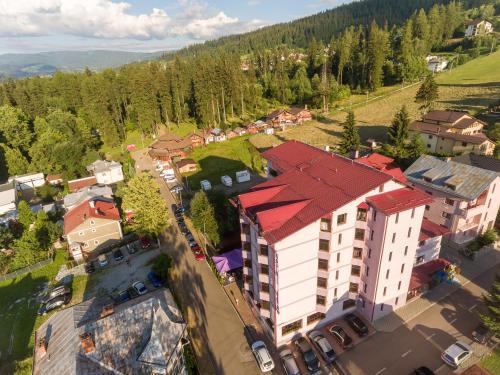 an overhead view of a building with a red roof at Hotel Dorna in Vatra Dornei