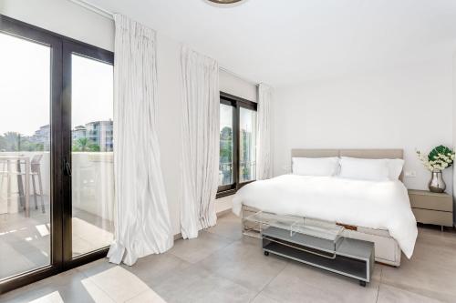 A bed or beds in a room at by RIVA - Chic, Contemporary Studio in Puerto Banus Gardens