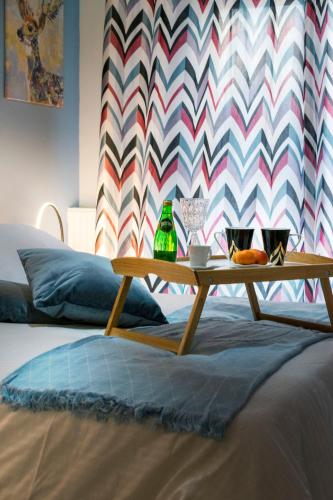 a coffee table sitting on top of a bed at Family Inn Apartments&suites in Neos Marmaras