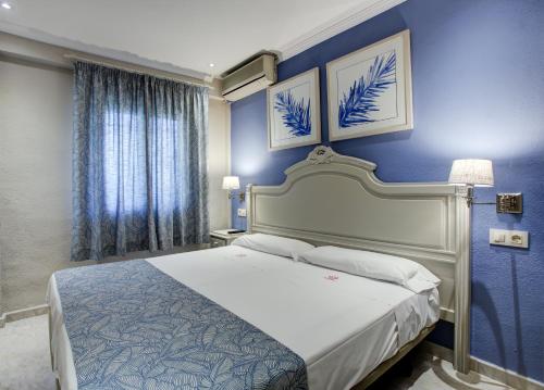Ліжко або ліжка в номері Hotel Rosa