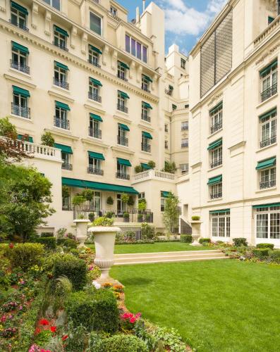 a large building with a lawn in front of it at Shangri-La Paris in Paris