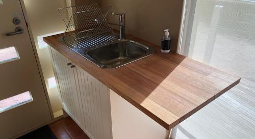 a kitchen counter with a sink in a room at Ou+look BnB in Rosevears