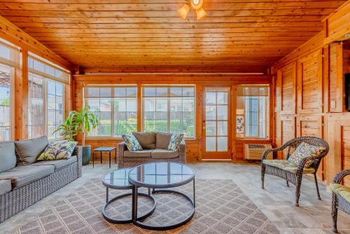 a living room with a couch and chairs and a table at Frisco finest home, large, pool, no parties! in Frisco