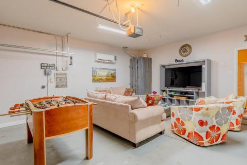 a living room with a couch and a table at Frisco finest home, large, pool, no parties! in Frisco
