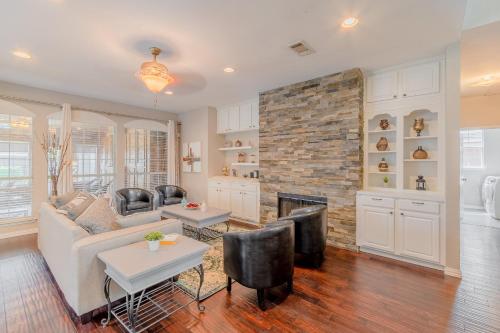 a living room with a couch and a fireplace at Frisco finest home, large, pool, no parties! in Frisco