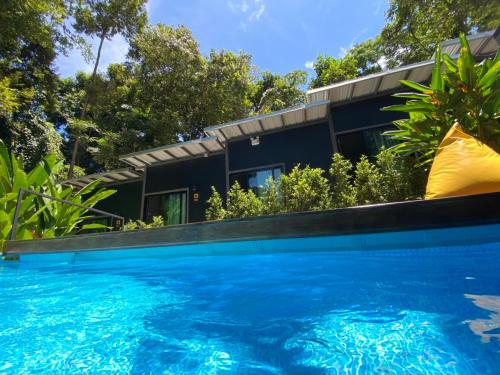 a house with a swimming pool in front of a house at BeachBox@Koh Сhang in Ko Chang
