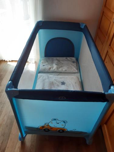 a blue bunk bed in a room at Home away from home in Bohinj