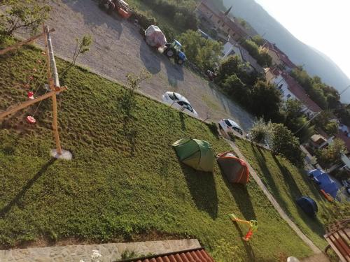 a group of tents on a grassy hill at Camping Jakomin in Koper