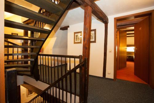 a spiral staircase in a house with a hallway at Hotel Ritter St. Georg in Braunschweig