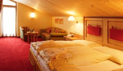 Ein Bett oder Betten in einem Zimmer der Unterkunft Hotel Montana