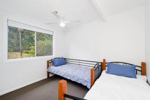 Ένα ή περισσότερα κρεβάτια σε δωμάτιο στο Bonny Beach House