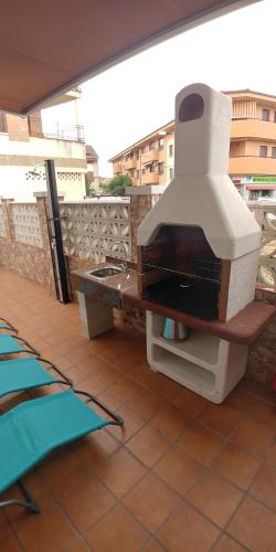 a grill sitting on top of a roof at La casita de lola in Sotillo de la Adrada