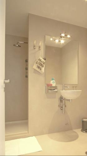 a bathroom with a sink and a mirror at Heart of Athens!! central nice rooftop flat in Athens