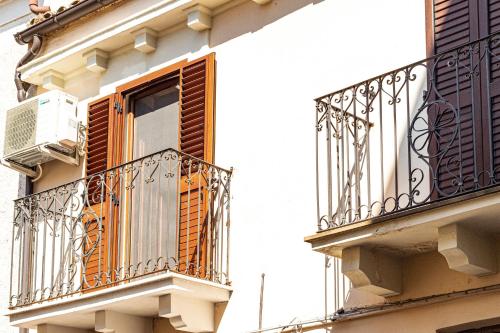 an apartment building with an open window and a balcony at B&B IL Cammino in Lanciano