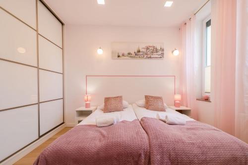 Posteľ alebo postele v izbe v ubytovaní Apartament Garden z ogródkiem - Dream Apart