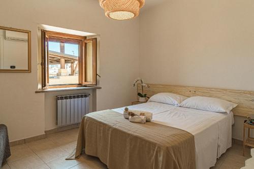 a bedroom with a bed with a teddy bear on it at B&B IL Cammino in Lanciano