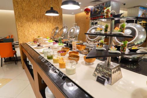 a buffet line with many different types of food at Tamu Hotel & Suites Kuala Lumpur in Kuala Lumpur