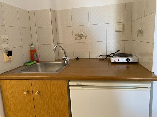 a kitchen with a sink and a toaster on a counter at Eolia beachfront studios in Plakias