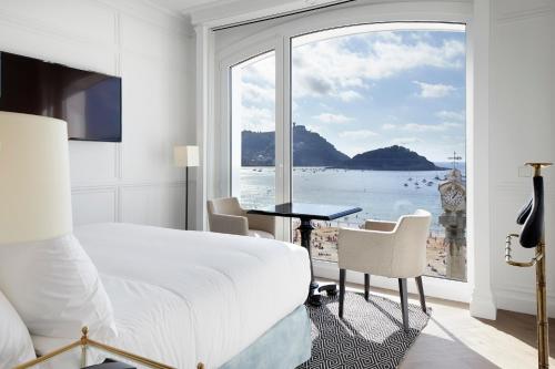 a hotel room with a view of the ocean at Hotel Boutique Villa Favorita in San Sebastián