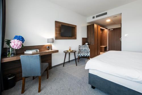 Cama o camas de una habitación en DB Hotel Wrocław