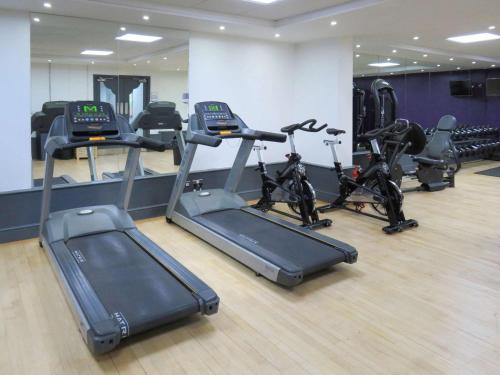 a gym with several treadmills and exercise bikes at Garner Hotel Preston Samlesbury by IHG in Preston