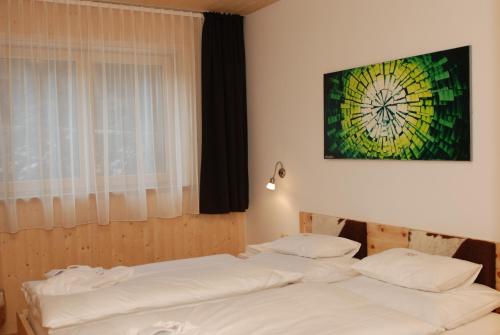Chalet Glemmtal - Haus Schmittenblick tesisinde bir odada yatak veya yataklar