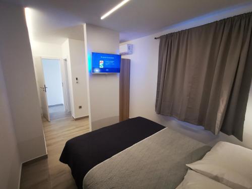Postel nebo postele na pokoji v ubytování SPA Apartment Vito