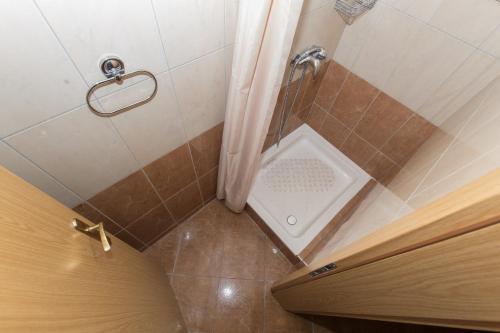 a bathroom with a shower with a toilet in it at Villa Ozzi with 9 bedrooms & private Pool in Makarska