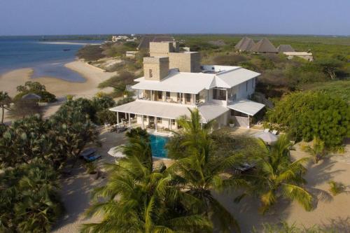 an aerial view of a house on the beach at The Majlis Resort in Lamu