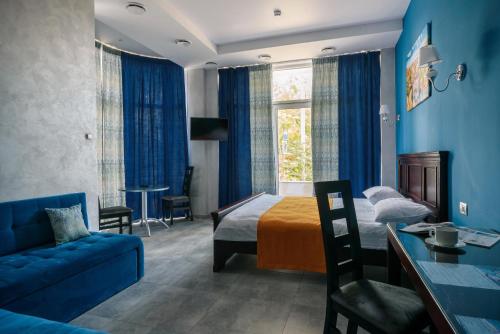 Postel nebo postele na pokoji v ubytování Gaudi stylish hotel