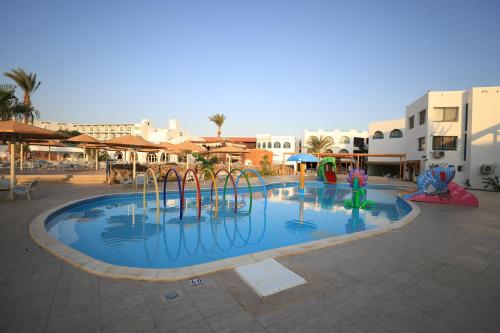 a large swimming pool with a water park at Shams Safaga Resort in Hurghada