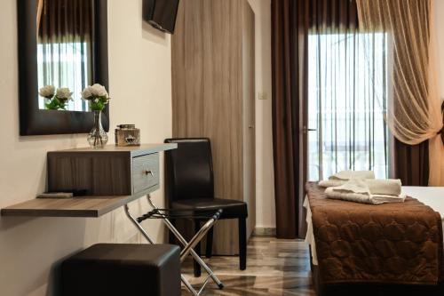 Posteľ alebo postele v izbe v ubytovaní Hotel Kostas