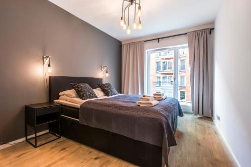 Posteľ alebo postele v izbe v ubytovaní City Break Gdańsk Rajska 8 Apartamenty