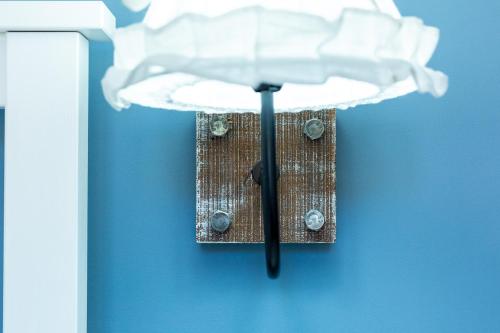 a light hanging from a wall with a white object at BnB Sant'Alfonso in Agrigento