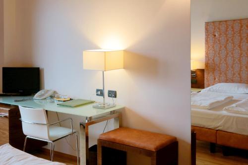 Ένα ή περισσότερα κρεβάτια σε δωμάτιο στο Hotel Lido