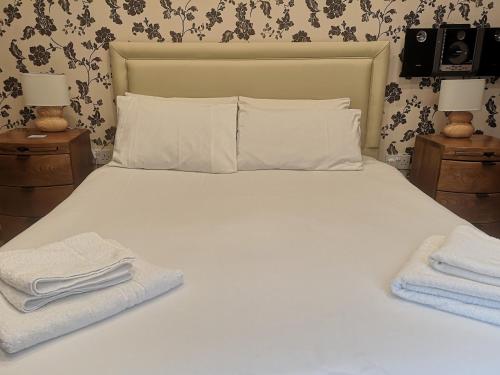 Ένα ή περισσότερα κρεβάτια σε δωμάτιο στο Charlotte House