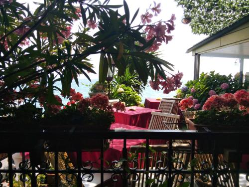 a flower shop with a table with flowers on it at Hotel Grifone in Sirmione