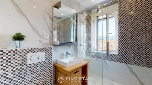 a bathroom with a sink and a mirror at Zhara Suite Five stars holiday house - Generale in Nice