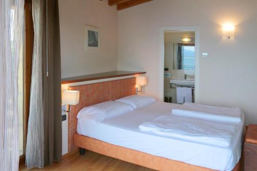 Ένα ή περισσότερα κρεβάτια σε δωμάτιο στο Hotel Lido
