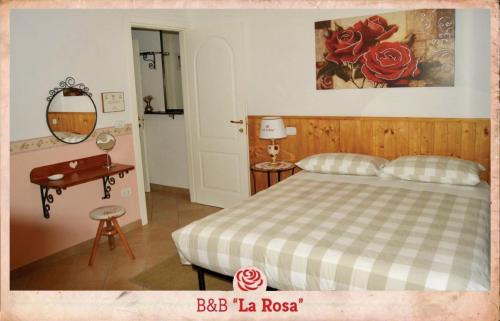 B&B La Rosa tesisinde bir odada yatak veya yataklar