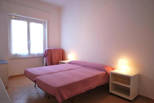 Letto o letti in una camera di Appartamenti Glicini da Luigi