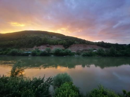 a view of a body of water at sunset at Prenoćište na Drini Foča in Foča
