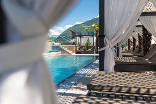 a view of the pool from the balcony of a resort at Hotel Ideal Park in Laives