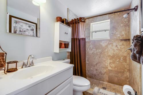 a bathroom with a sink and a toilet at Gulf View Cottage #3 in Bradenton Beach