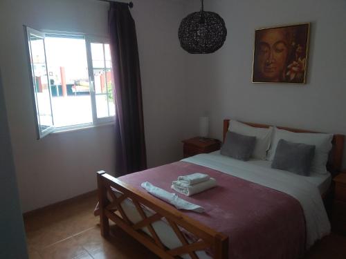 Posteľ alebo postele v izbe v ubytovaní AL Casa das Andorinhas